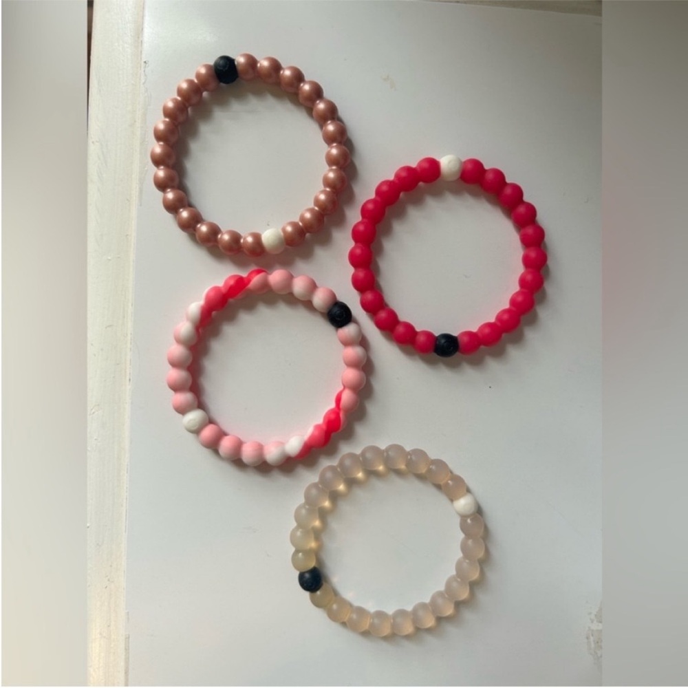Pack of 4 Lokai Bracelets size small. Clear, pink pattern, hot pink, rose gold.